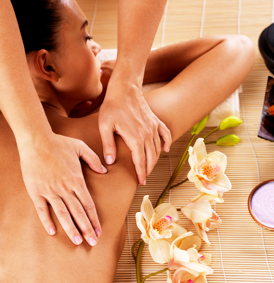 Adult Woman in Spa Salon Having Body Massage.